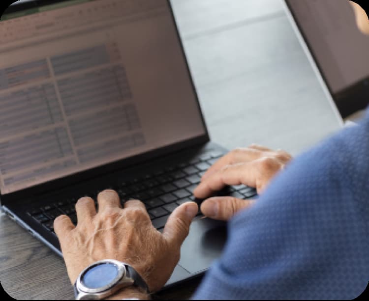 Male hands writing on laptop